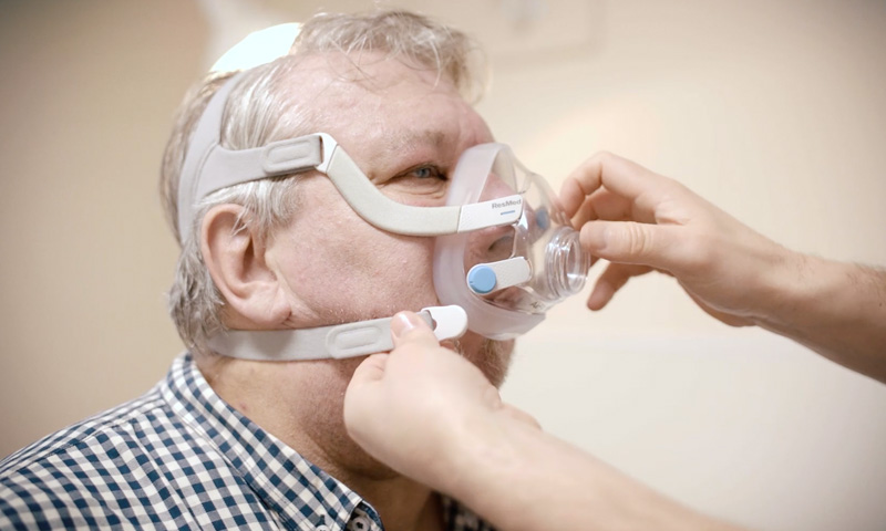 Man being fitted with breathing apparatus